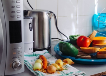 photo of vegetables beside gray electric kettle