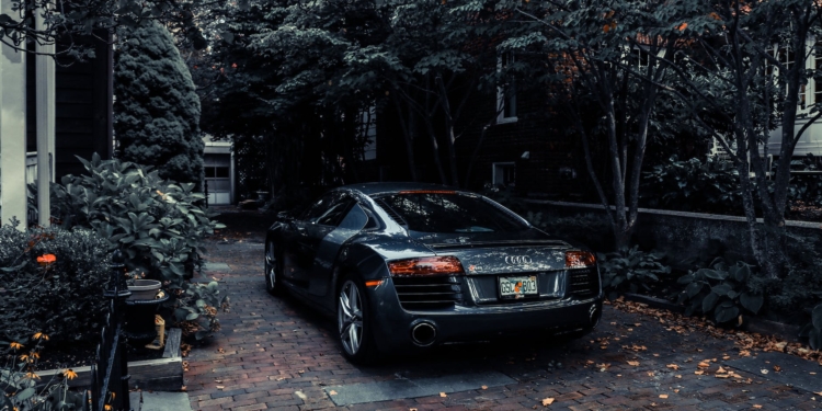 photo of audi parked near trees