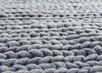 close up of gray cable knit cloth