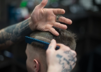 person combing person s hair