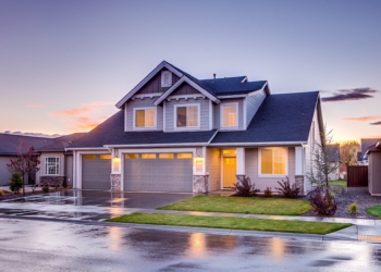 blue and gray concrete house with attic during twilight