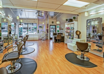 white and brown chairs inside a salon