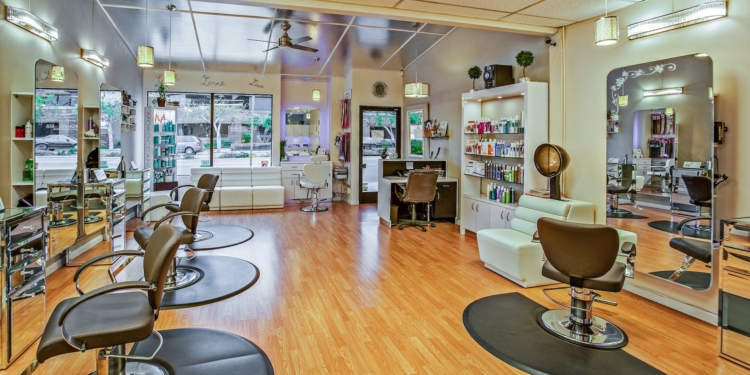 white and brown chairs inside a salon