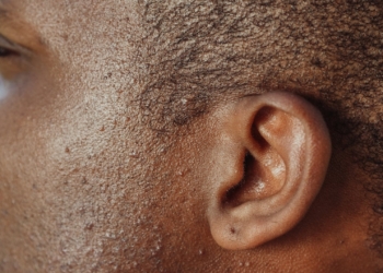 man s ear in close up photography