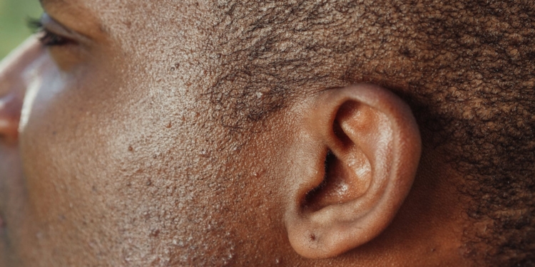 man s ear in close up photography