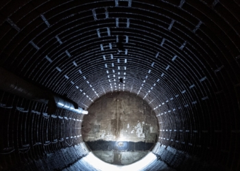 a dark tunnel with a light at the end