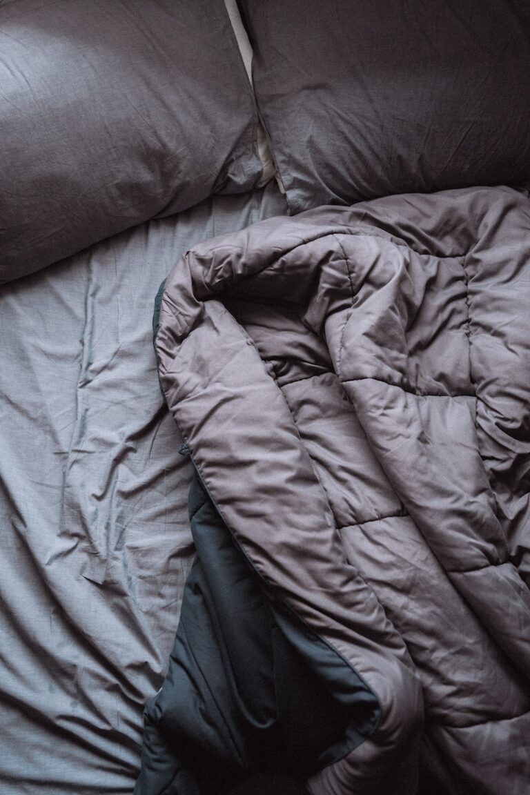 blue bed linen on bed