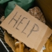 A Cardboard with the Word Help Written
