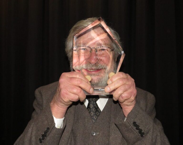 wes goofing with award