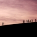 silhouette of people on hill