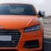 orange Audi vehicle