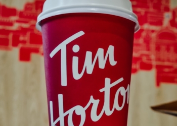 a cup of coffee sitting on top of a table