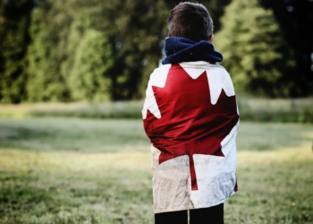 child wearing Canada flag