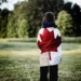 child wearing Canada flag