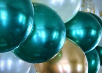 blue and white balloons on white surface