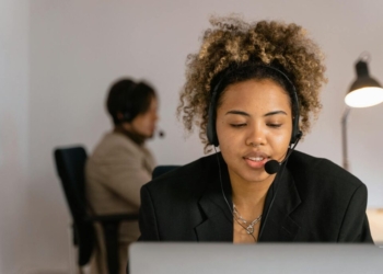 Woman in Black Blazer Sitting on Chair