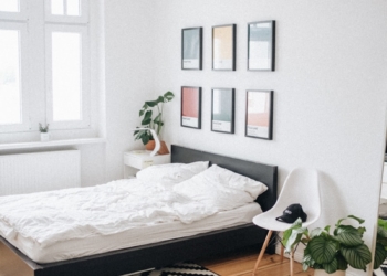 black platform bed with white mattress inside bedroom
