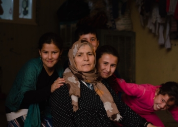 a group of people sitting around each other