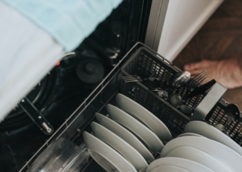 white ceramic plate on black dishwasher