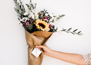 person holding bouquet of flowers