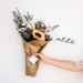 person holding bouquet of flowers