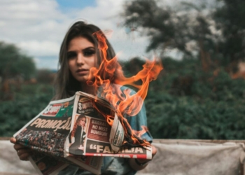 Woman Burning Newspaper
