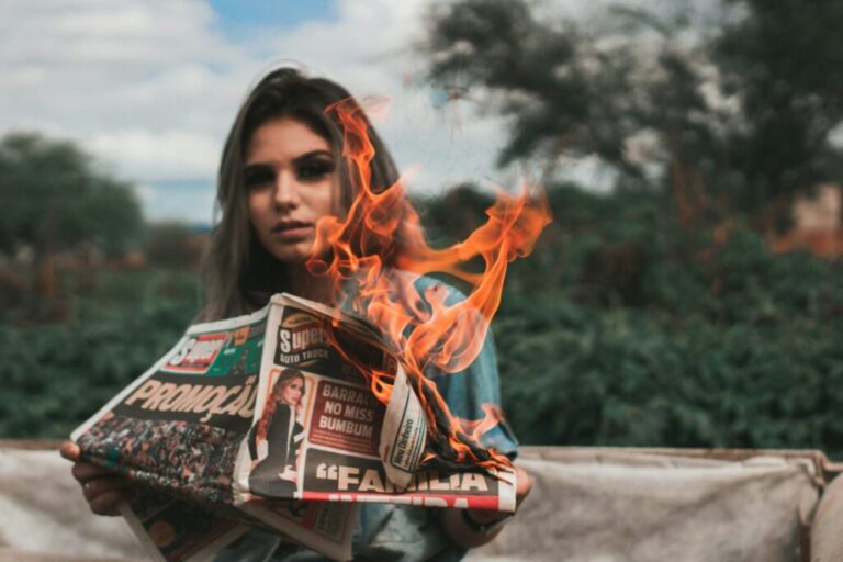 Woman Burning Newspaper