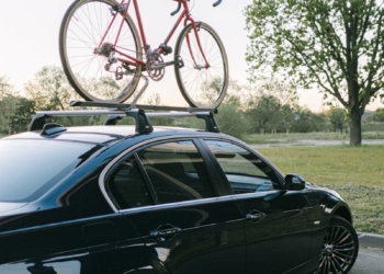 A Bike on the Roof Rack of an Automobile