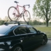 A Bike on the Roof Rack of an Automobile