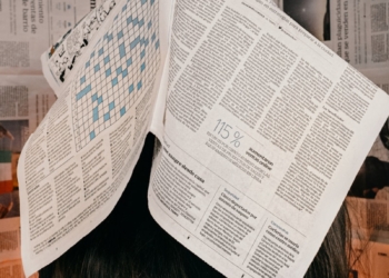 white printer paper on brown wooden table