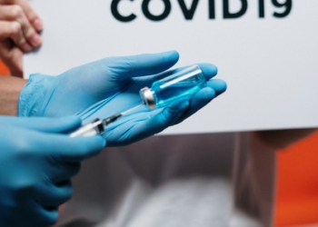 Person Holding Syringe