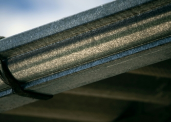 a close up view of a metal gutter