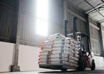 a forklift with a stack of boxes on top of it