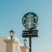 A starbucks sign on top of a building