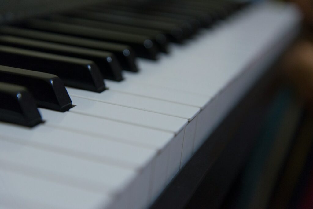 a close up of a black and white piano