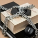 Chain-locked book, phone, and laptop symbolizing digital and intellectual security.