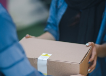 person giving brown box