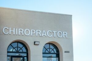 a building with two arched windows and a sign that says chiropractor