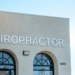 a building with two arched windows and a sign that says chiropractor