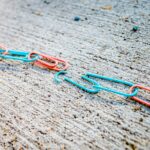 blue green and red plastic clothes pin