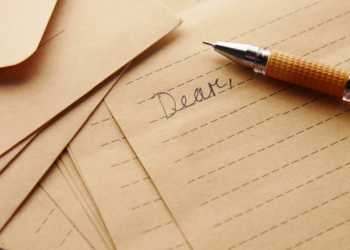 a pen sitting on top of a piece of paper