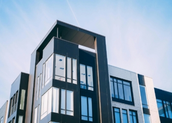 black and white cocnrete building low-angle photography