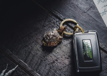 a keychain with a picture of a pine tree on it