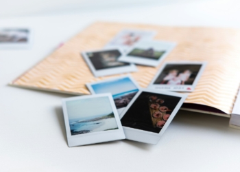 photos on white wooden table