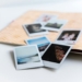 photos on white wooden table