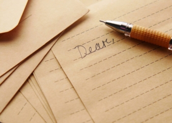 a pen sitting on top of a piece of paper