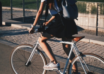 woman riding white rigid bike