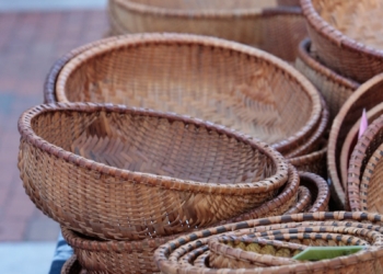 a pile of wicker baskets sitting on top of a table
