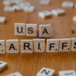 A close up of scrabble tiles spelling the word usa, tarifs