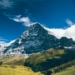 landscape photography of mountain under white clouds